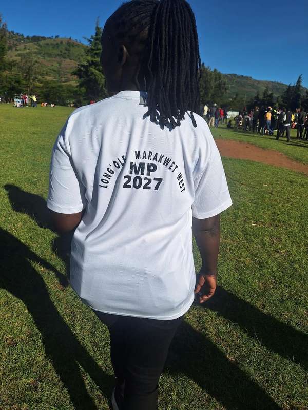 A supporter wearing a white T-shirt printed Long’ole Marakwet West MP 2027
