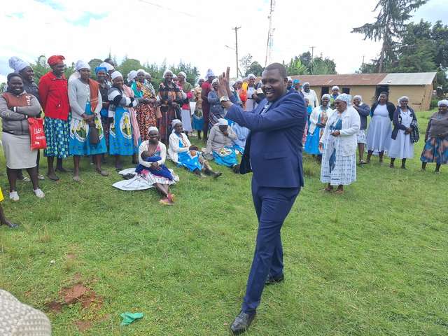 Long’ole clapping and dancing with a joyful women’s group in church uniforms